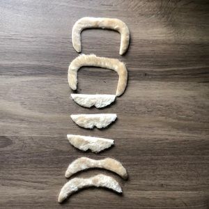 A lot of seven peel-and-stick obviously fake mustaches